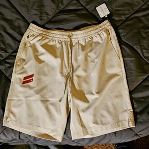 NWT Hurley athletic shorts. Size medium in a creamish color. Lightweight